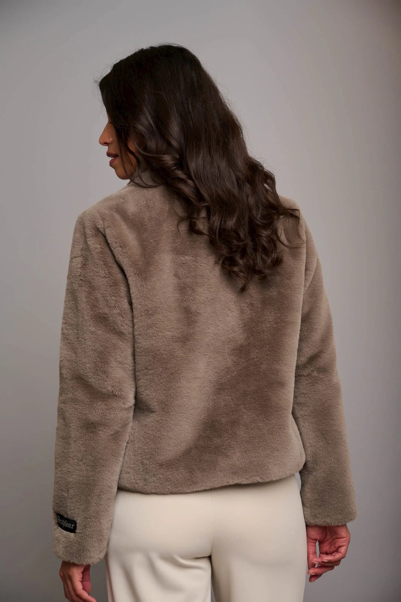 Taupe short faux fur jacket with button fastening