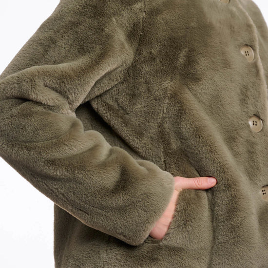 green faux fur short jacket with stand collar from rino and pelle close up