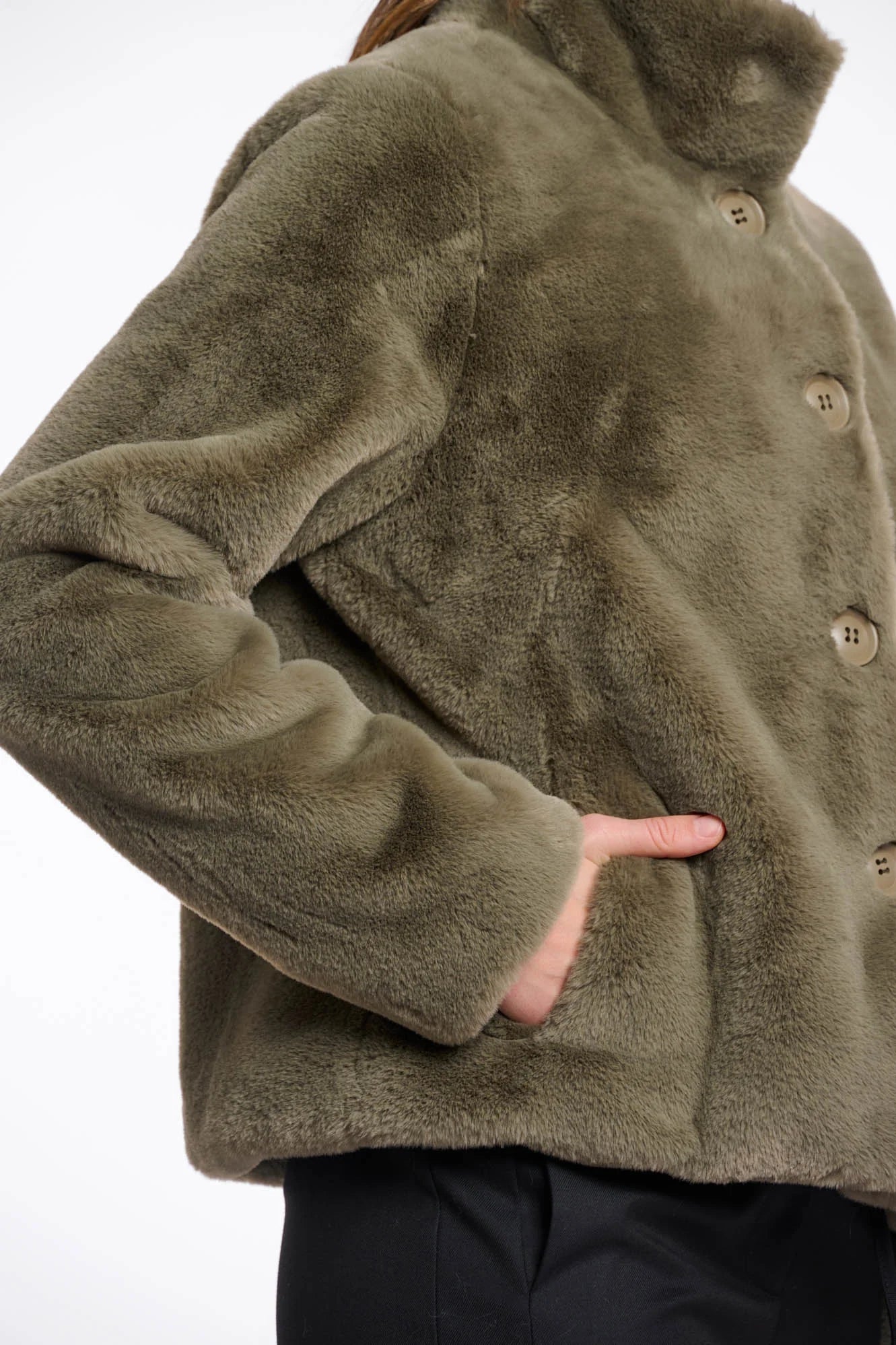green faux fur short jacket with stand collar from rino and pelle close up