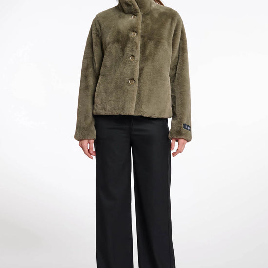 green faux fur short jacket with stand collar from rino and pelle model shot