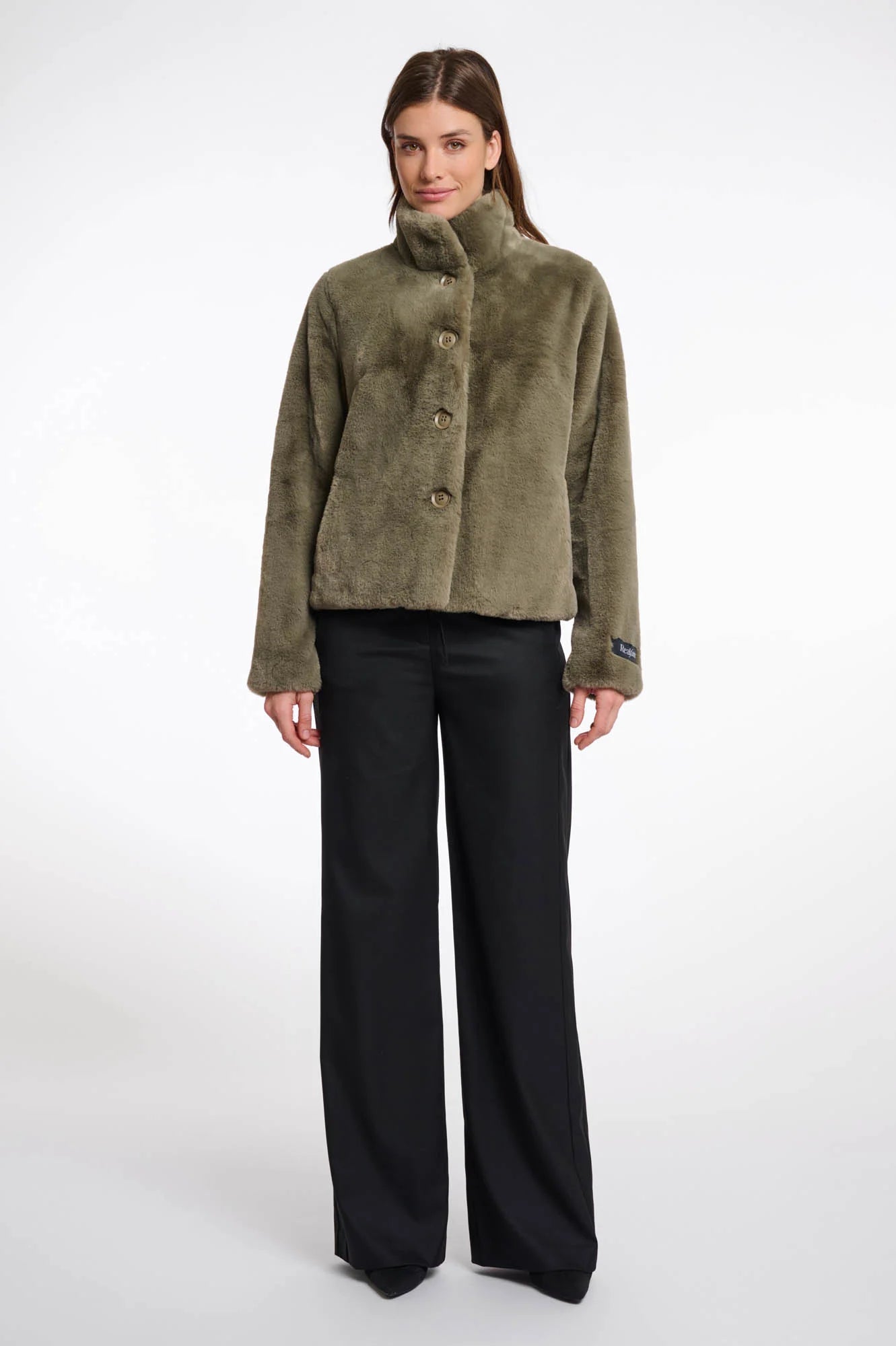 green faux fur short jacket with stand collar from rino and pelle model shot