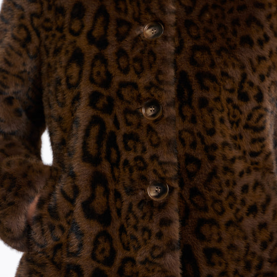 leopard print short faux fur jacket with brown buttons and stand collar close up
