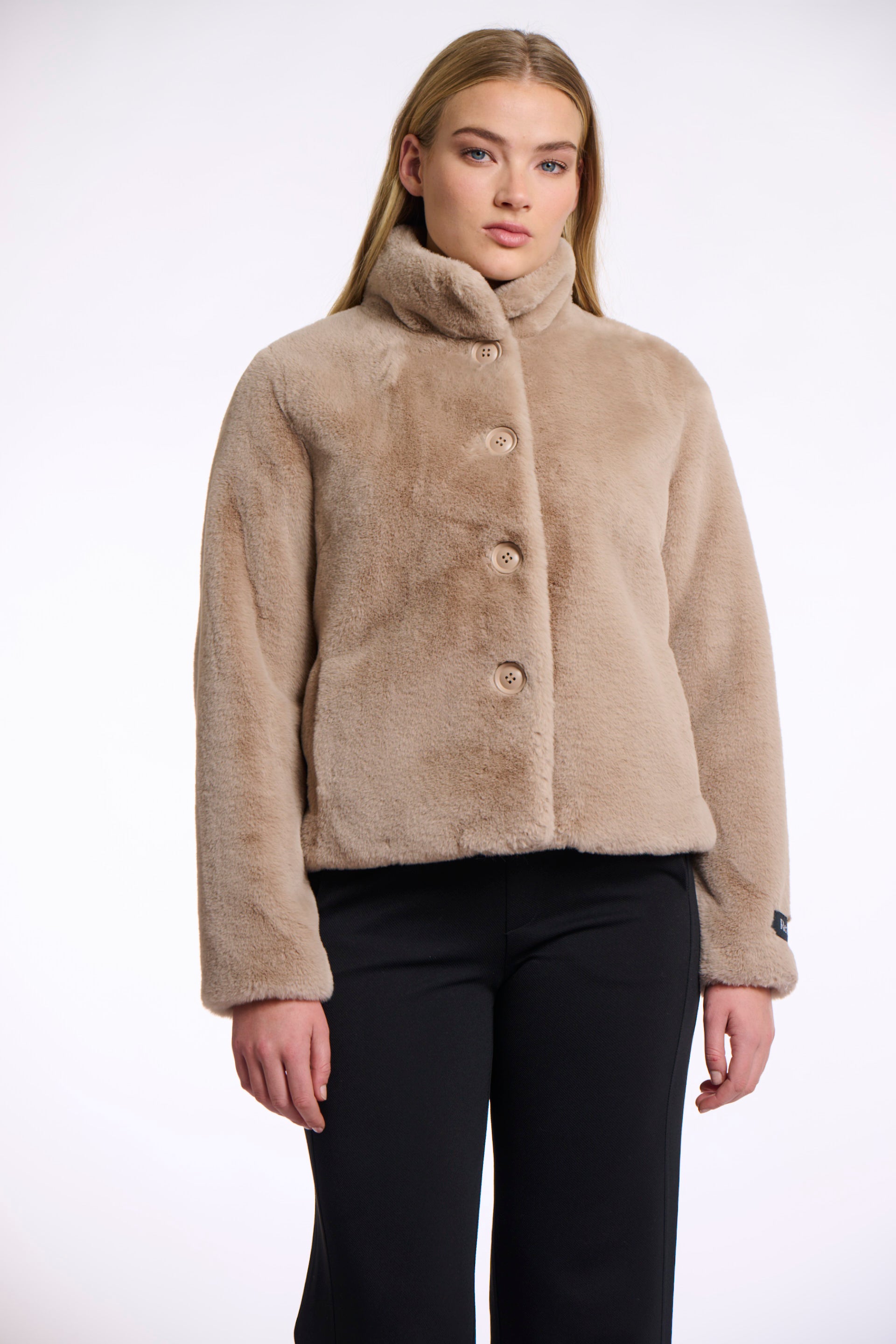 Short faux fur jacket with oatmeal hue, beige buttons and high neck model shot