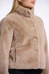 Short faux fur jacket with oatmeal hue, beige buttons and high neck side view