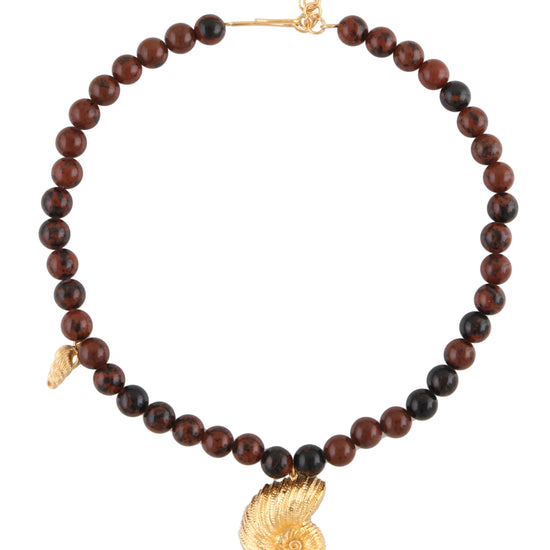 brown beaded necklace with statement seashell in the centre 