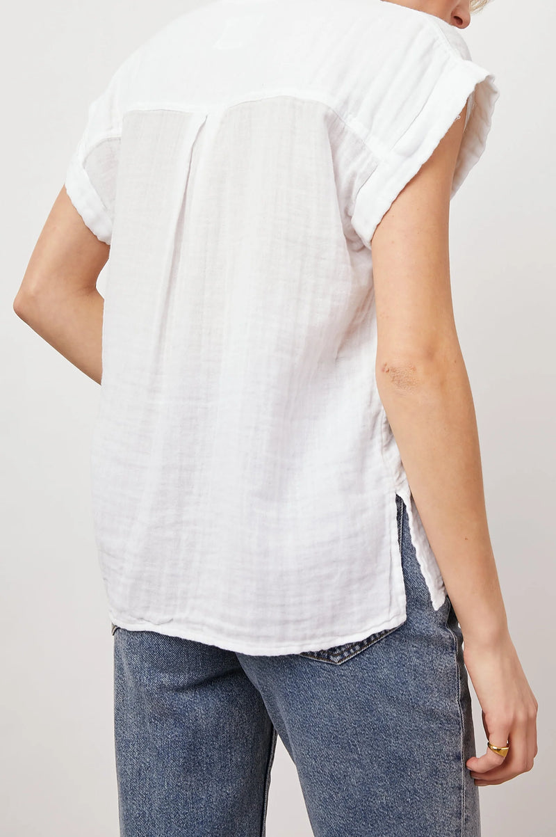 White short sleeved muslin shirt with front patch pocket classic collar and rolled grown on short sleeves