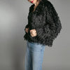 black faux fur feather effect short jacket close up