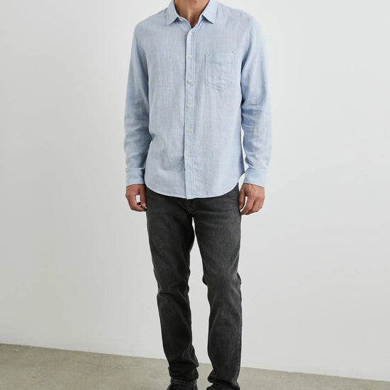 light blue shirt with chest pocket and curved hem