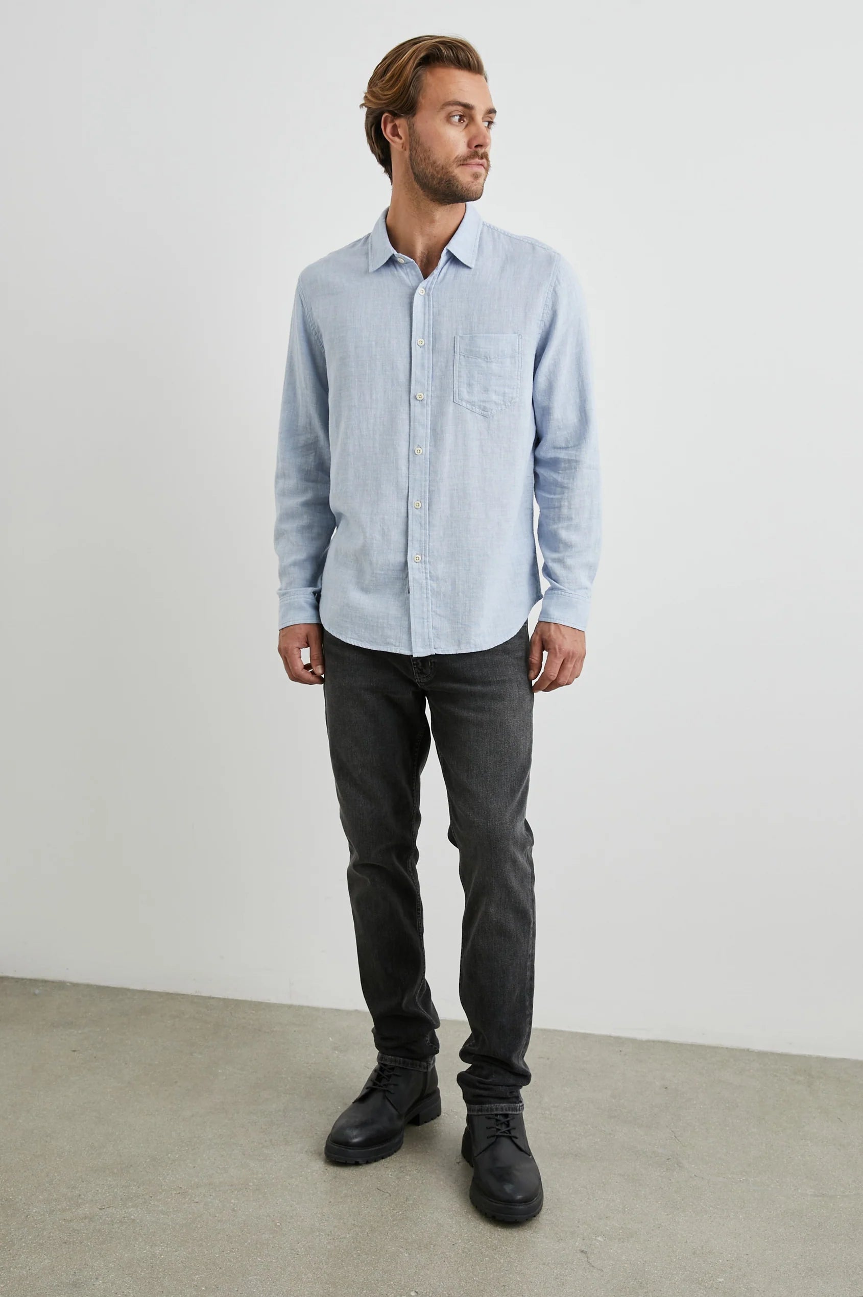 light blue shirt with chest pocket and curved hem