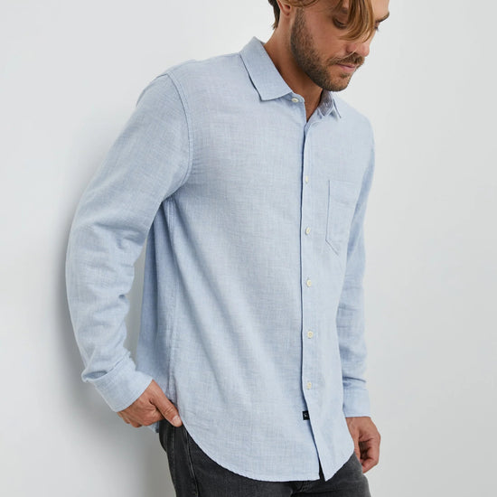 light blue shirt with chest pocket and curved hem