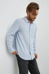 light blue shirt with chest pocket and curved hem