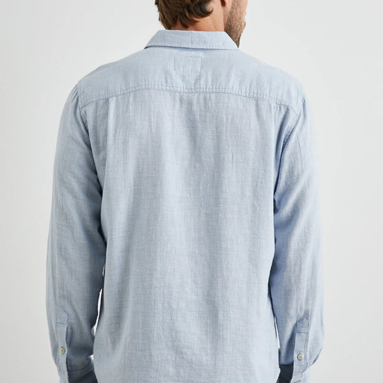 light blue shirt with chest pocket and curved hem rear view 