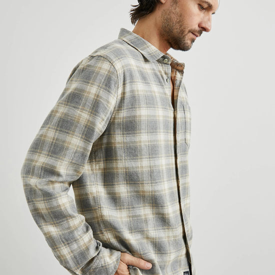 grey check shirt with chest pocket and curved hem  side view 