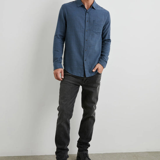 blue shirt with chest pocket and curved hem 