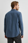 blue shirt with chest pocket and curved hem rear view 