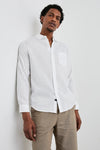 white shirt with chest pocket and curved hem