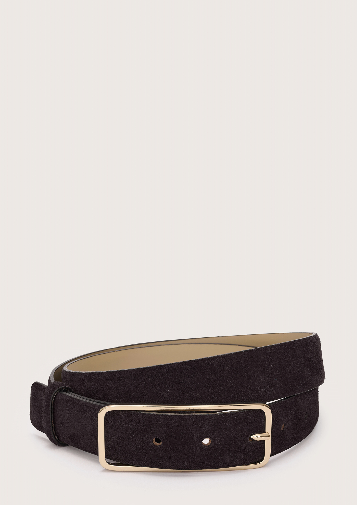 Black belt with a gold buckle on a light gray background from Abro