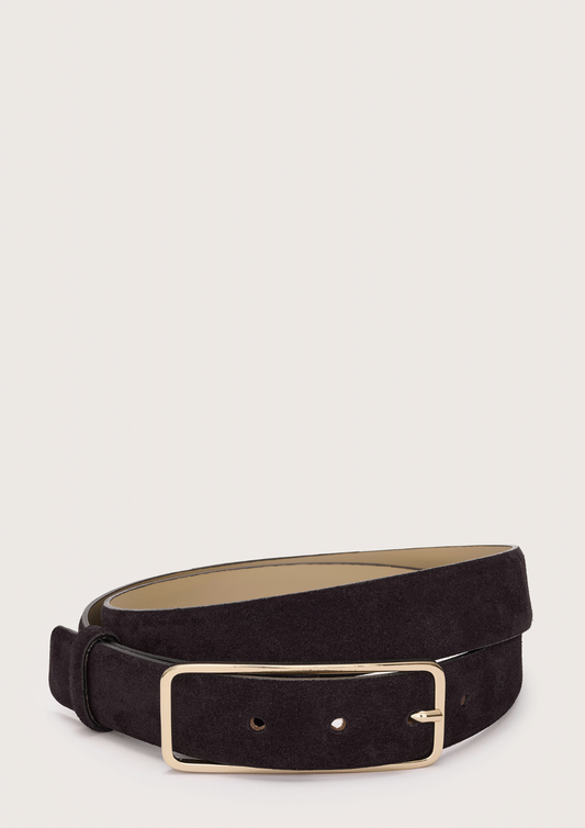 Black belt with a gold buckle on a light gray background from Abro