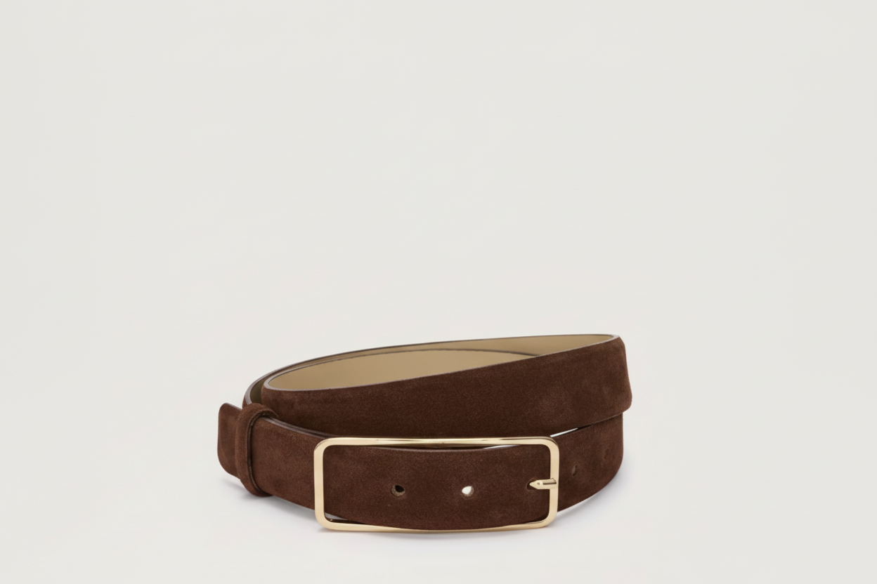 Burgundy suede belt with a gold buckle on a light gray background from abro