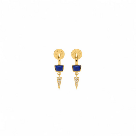A pair of gold drop earrings featuring a circular stud with a small blue enamel inlay and a dangling chevron-shaped charm paved with clear stones, shown on a plain white background.