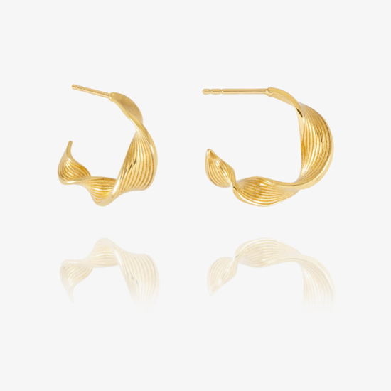 A pair of gold-toned twisted hoop earrings with a textured, ribbed surface, displayed on a clean white background with a soft reflection below.