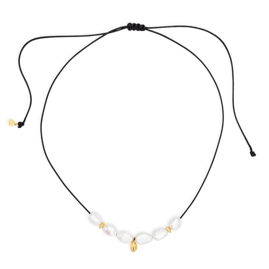 Necklace with black cord and small beads on a white background