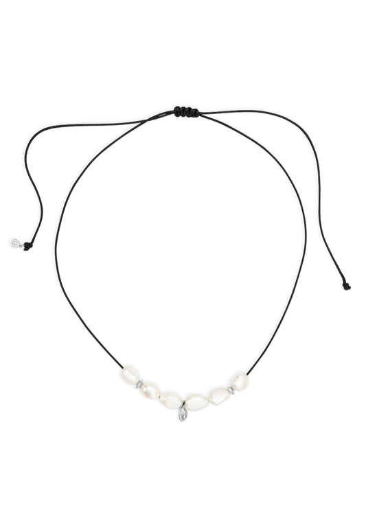 Necklace with black cord and small pendants on a white background