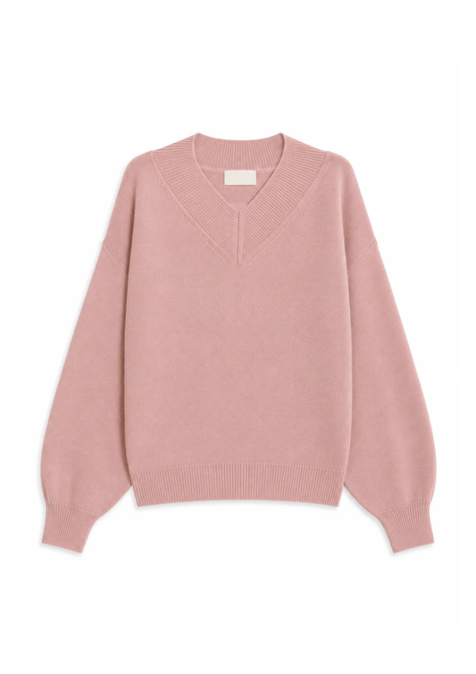 A dusty pink knit sweater with a V-neckline, long sleeves, and ribbed cuffs and hem, displayed flat against a plain white background.