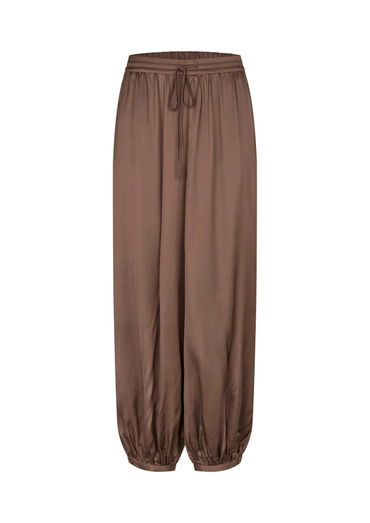 A pair of loose-fitting brown harem-style pants with an elastic drawstring waist and gathered elastic cuffs at the ankles, shown against a plain white background.