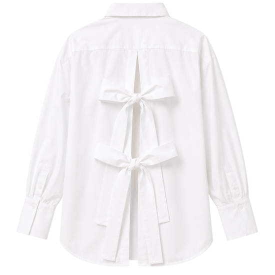 Classic white shirt with open back and bows on the white background