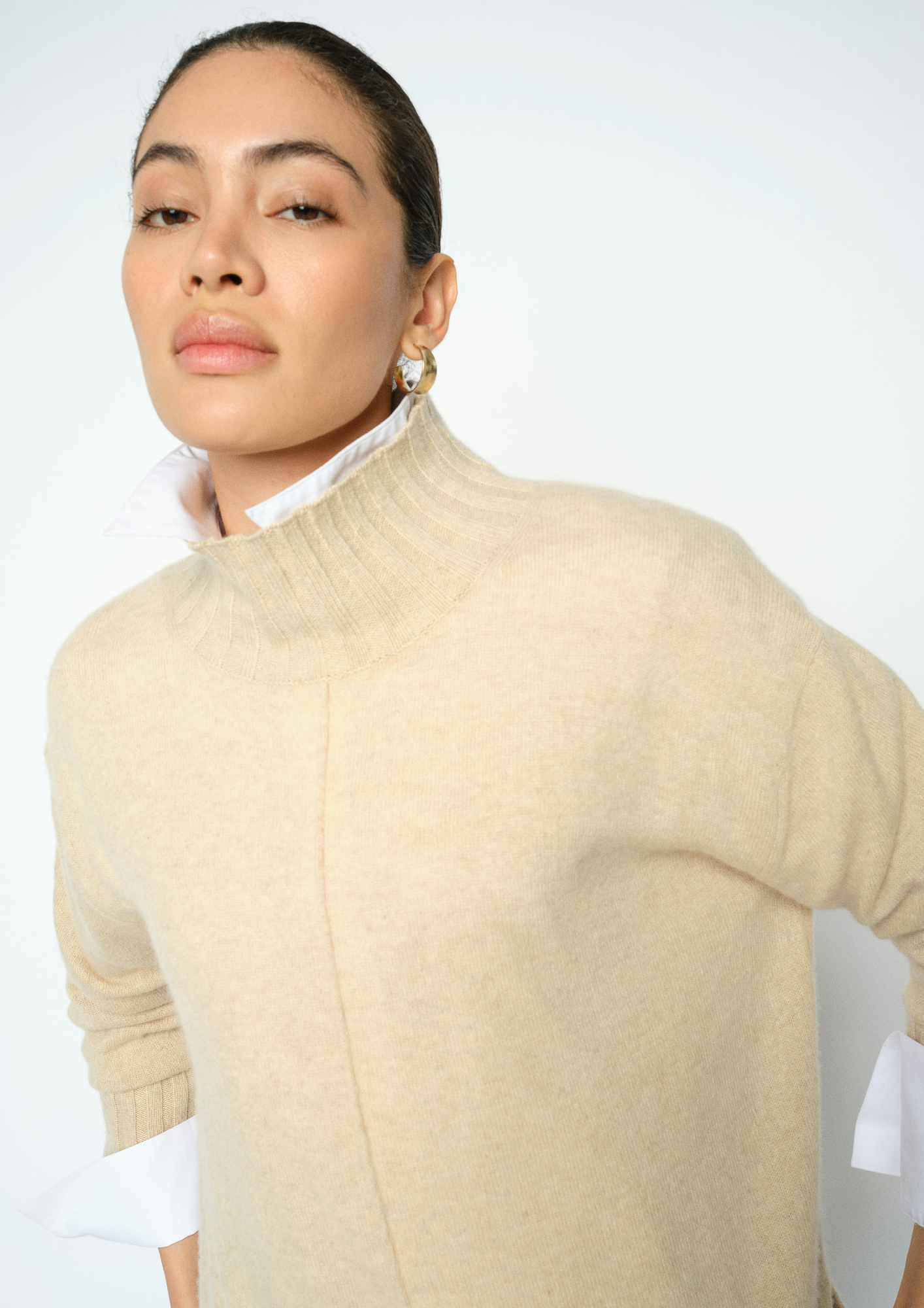 woman wearing high neck jumper close up