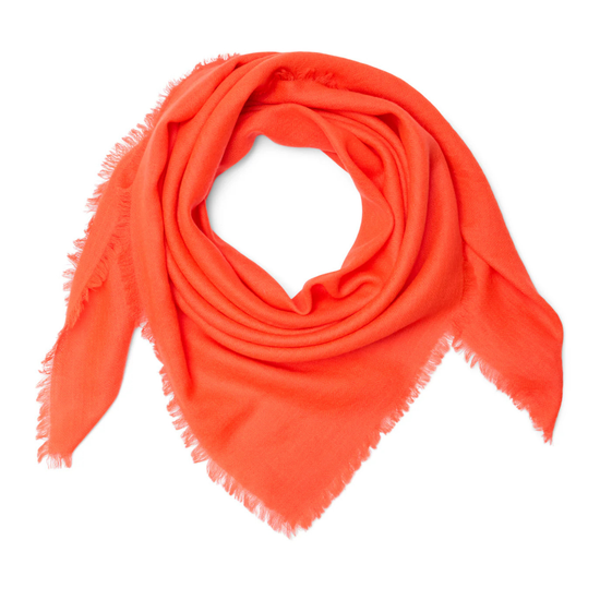 Orange scarf with frayed edges on a white background