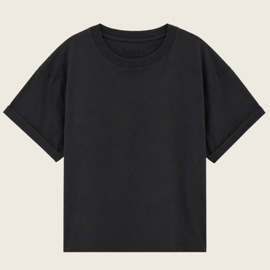A plain black short-sleeve crewneck t-shirt displayed flat against a light beige background.
