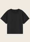A plain black short-sleeve crewneck t-shirt displayed flat against a light beige background.