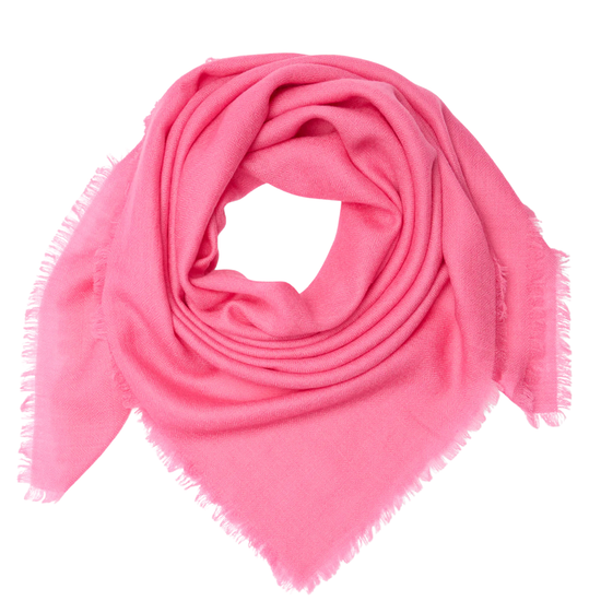 Pink scarf with frayed edges on a white background