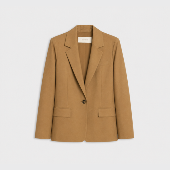 flat lay of a camel jacket on a plain white background 