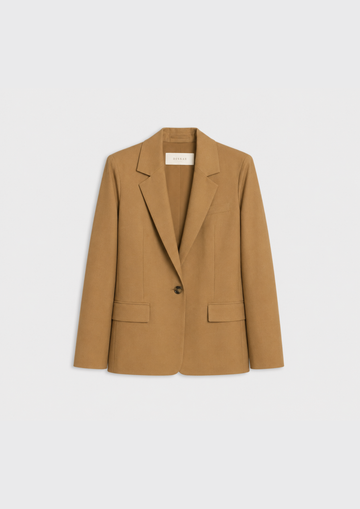 flat lay of a camel jacket on a plain white background 