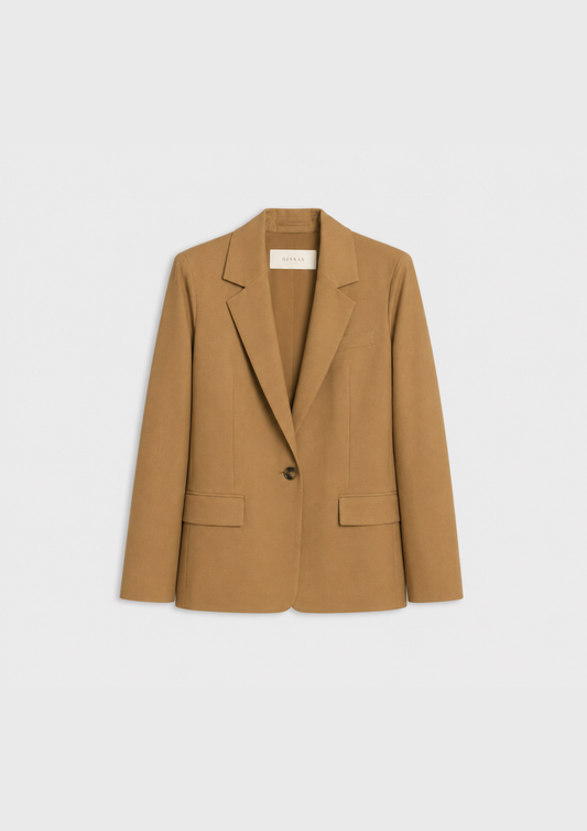 flat lay of a camel jacket on a plain white background 