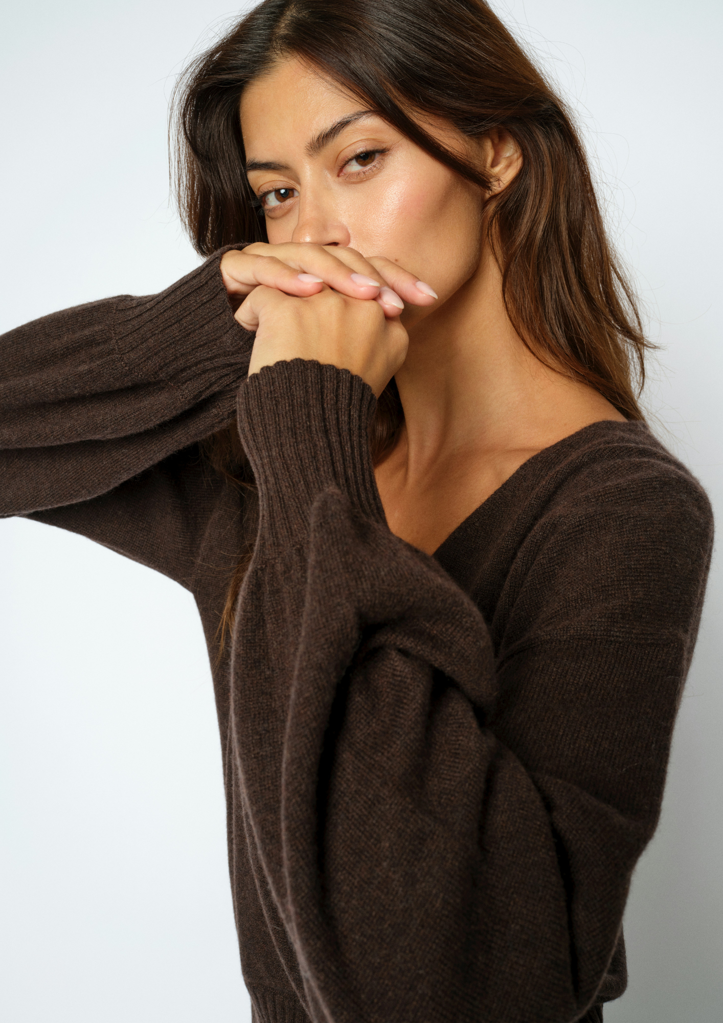 Woman wearing a brown wrap cardigan close up 
