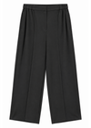 flat lay of black suit trousers on a white background