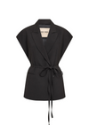 Sleeveless black blazer with tie on a white background 