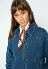 Woman wearing Scarf with hands and faces with a denim jacket