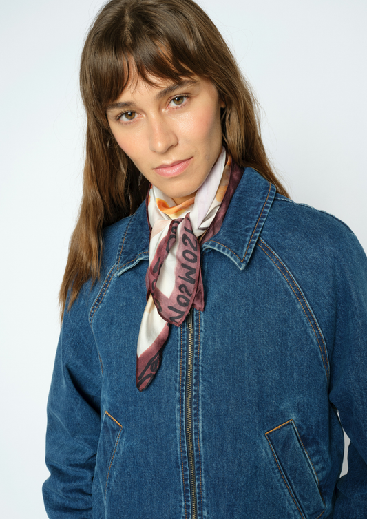Woman wearing Scarf with hands and faces with a denim jacket