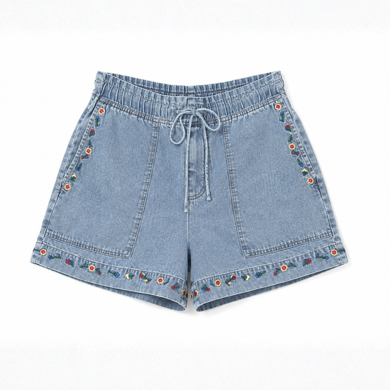 Blue denim shorts with floral embroidery on a white background