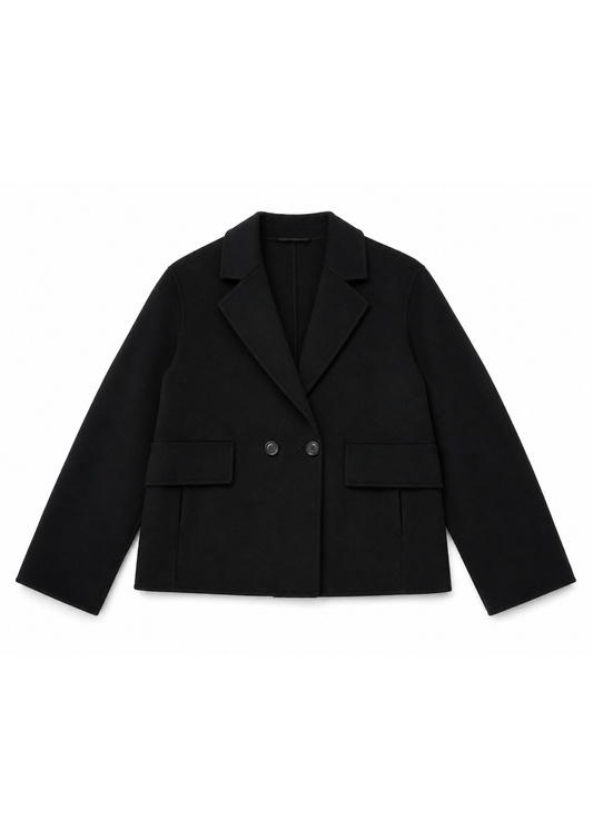 A black cropped double-breasted blazer with notched lapels and flap pockets, displayed flat against a solid white background.
