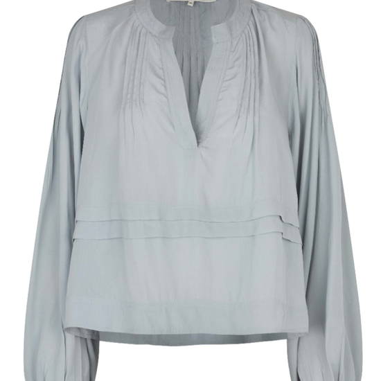 A light gray long-sleeve blouse with a gathered, pleated V-neckline and a peplum-style waist seam, shown against a plain white background.