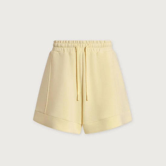 Light yellow shorts on a light gray background