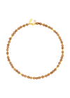 A beaded necklace made of small, round, warm brown beads separated by tiny gold spacer beads, with a gold clasp and a small pearl accent, shown on a plain white background.