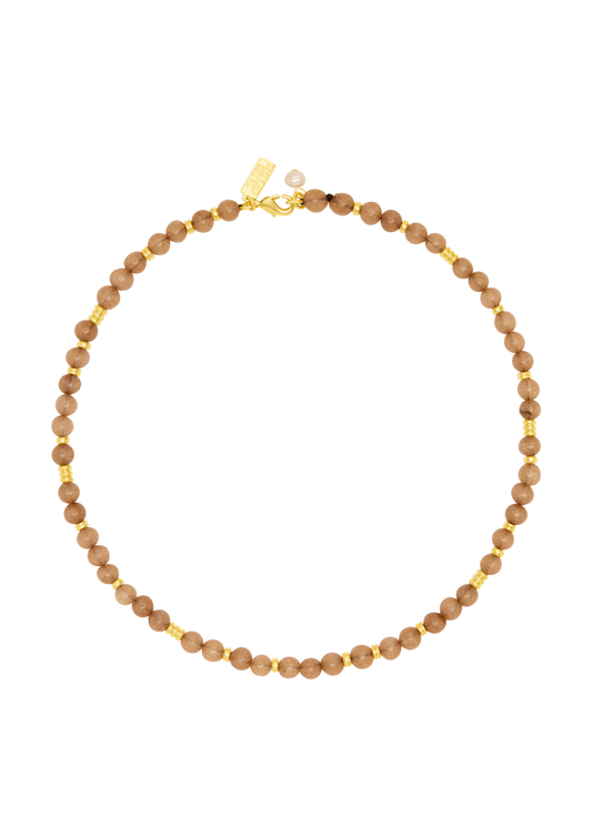 A beaded necklace made of small, round, warm brown beads separated by tiny gold spacer beads, with a gold clasp and a small pearl accent, shown on a plain white background.