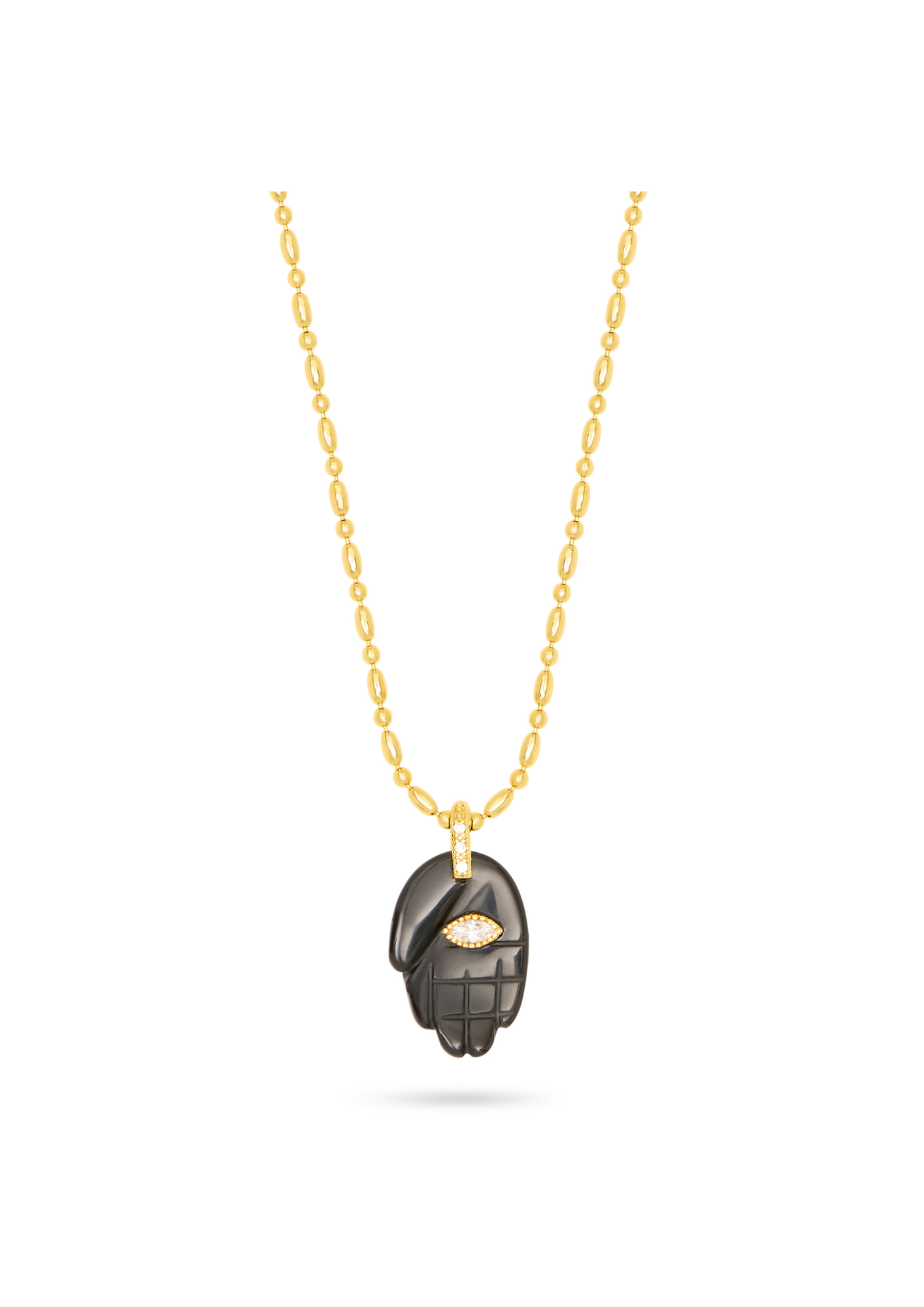 black hand pendant on a gold chain, with a gemstone in the centre, as a flat lay image on a plain white background 